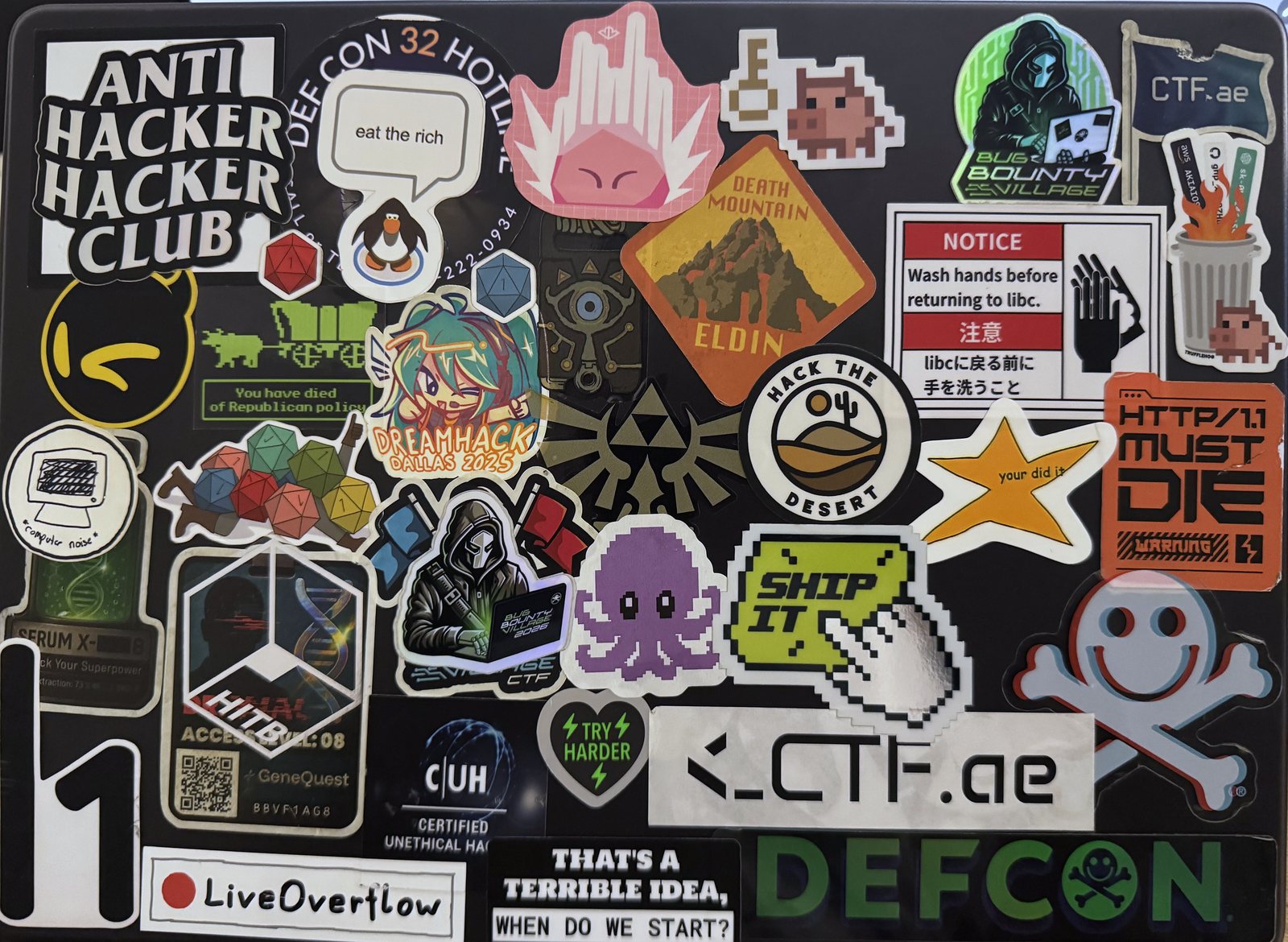 The MacBook Pro 16 lid, covered in about 36 stickers