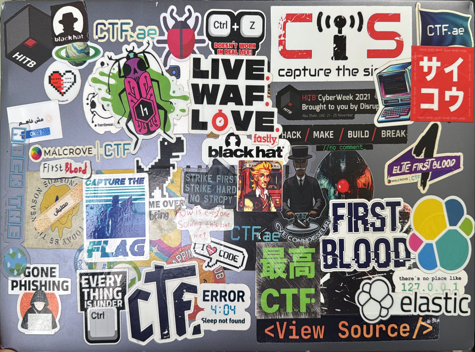 The HUAWEI MateBook D16 lid, covered in about 50 stickers